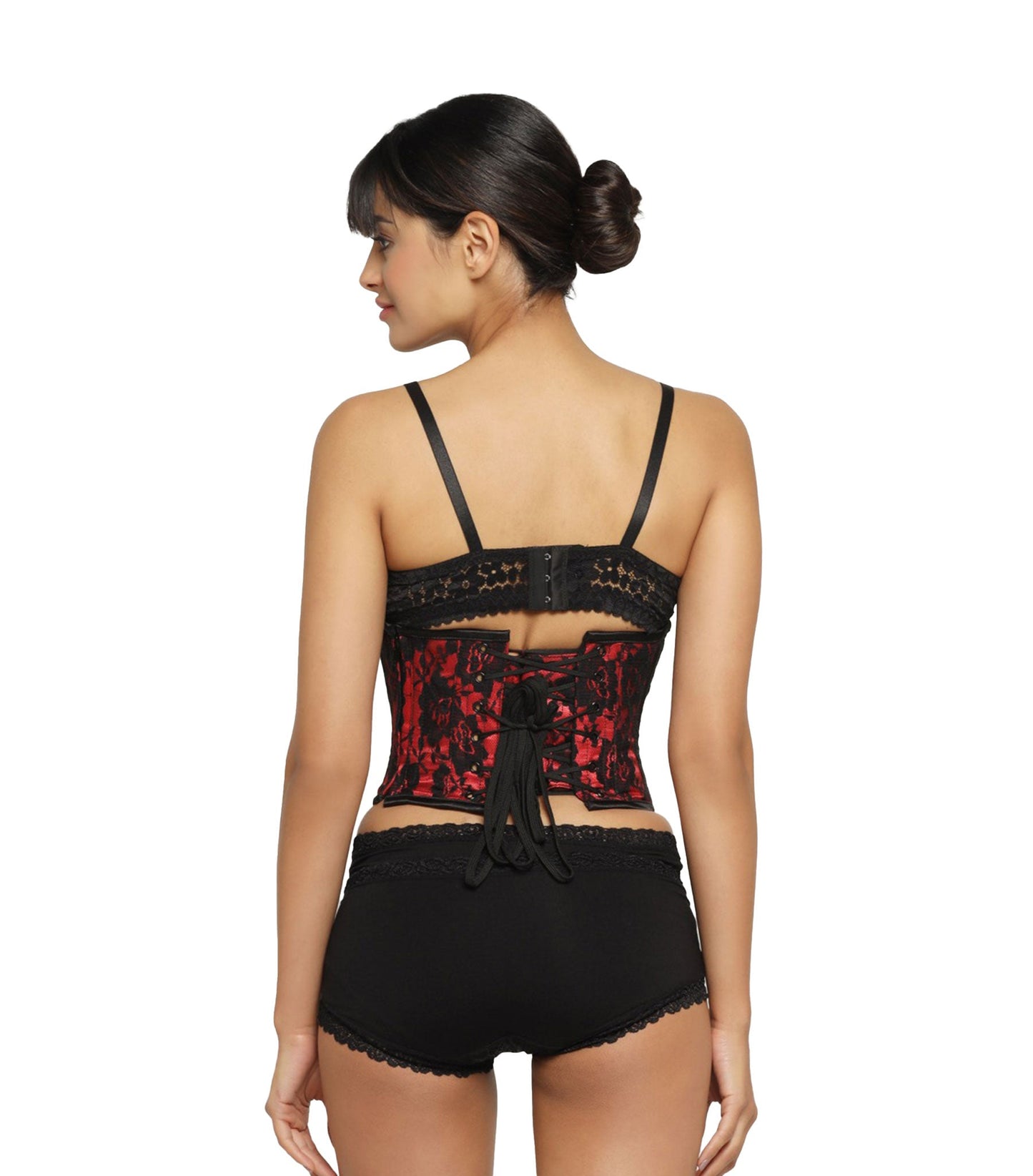 A woman shown from the back wearing a black lace lingerie set with a red lace corset-style back panel and black lace-trimmed shorts, against a plain white studio background.