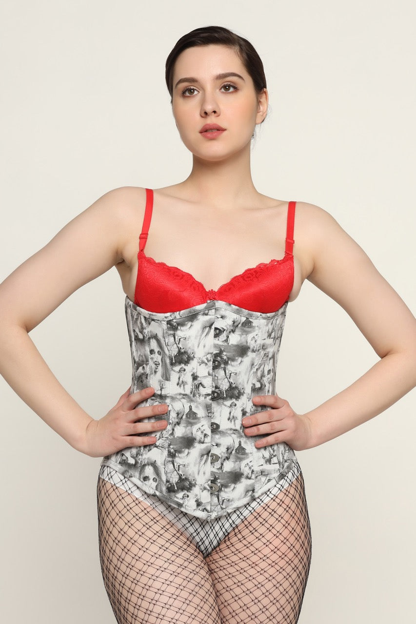 A model wearing a red and gray floral printed waist reducing longlined underbust corset with a red bra and thong.
