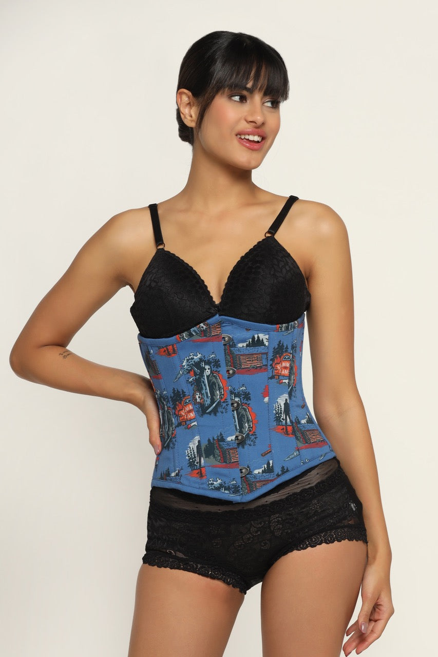 A woman wearing a black underbust corset with a Halloween printed waist reducing design on the front.