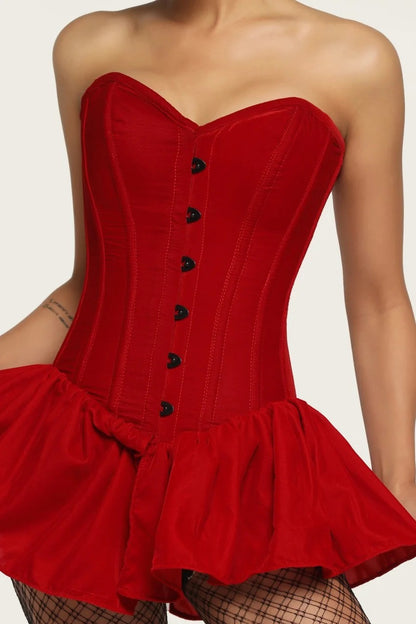 Red strapless dress with black buttons on a plain background