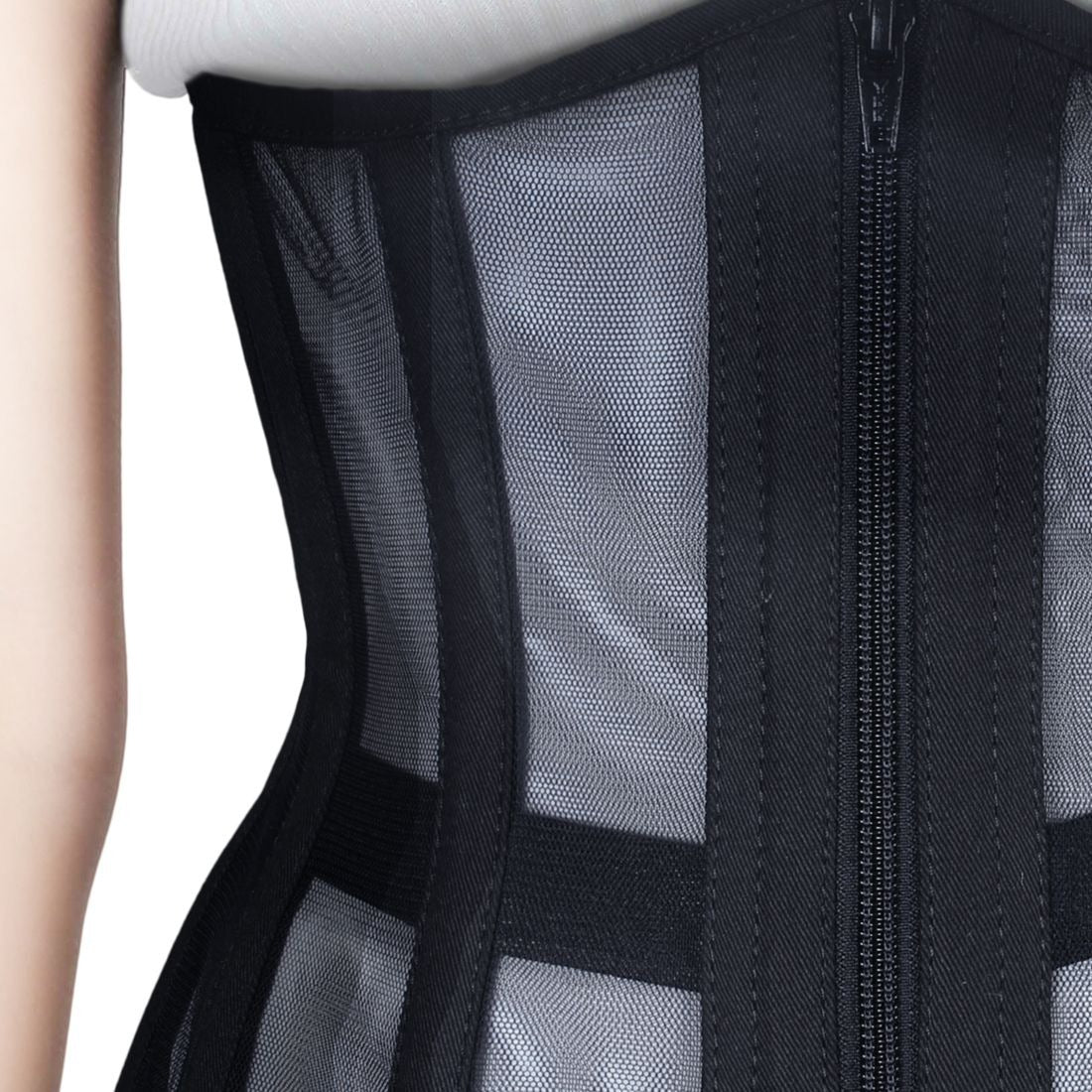Close-up of a black mesh and fabric corset with a front zipper, shown on a model against a white background.